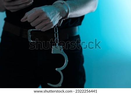 Young man desperate to catch the iron prison,prisoner concept,Handcuffed hands of a prisoner in prison, Male prisoners were severely strained in the dark prison, violence, 