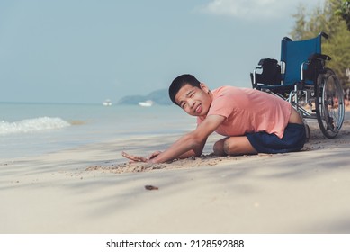 Young Man With Disability Relax And Practice Small Muscle Skills Through Sand Play And Large Muscles Skills Through Crawling On The Beach In Summer, Outdoor Natural Therapy And Mental Health Concept.