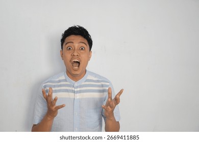 A young man displays a dramatic expression, showcasing intense emotions and dynamic gestures.