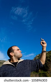 A Young Man Displeased By Getting No Signal On His Phone