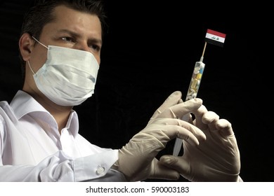 Young Man As A Doctor Gives A Medical Injection To Iraqi Flag On A Black Background