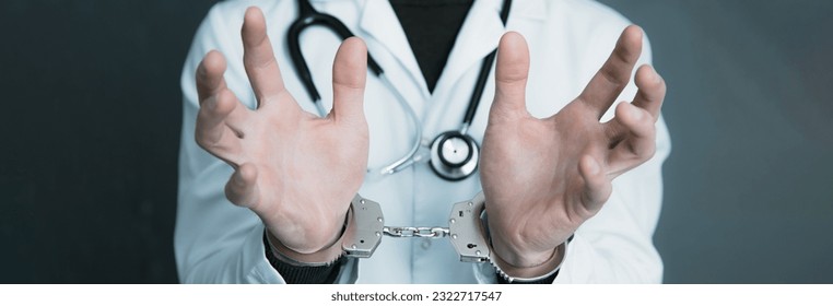 young man doctor hand handcuffs
