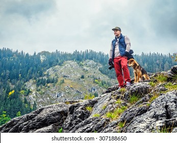 Young Man With Dog Outdoors