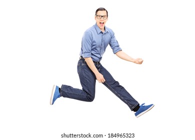 Young Man Doing An Air Guitar Jump Isolated On White Background