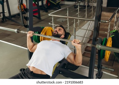 Young Man Doing Bench Press Exercise