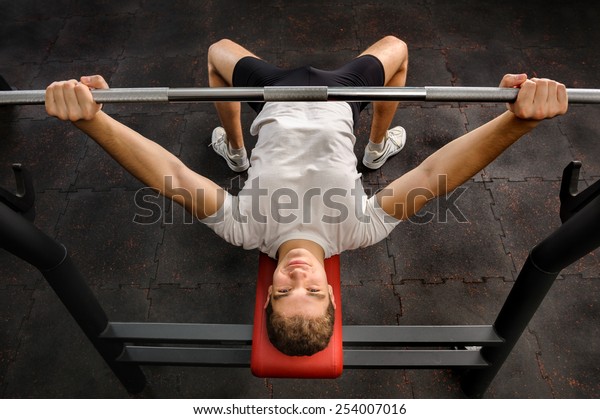 Young Man Doing Bench Press Workout Stock Photo Edit Now 254007016