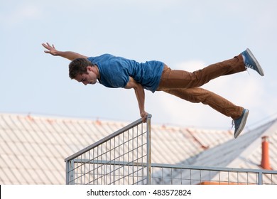 Young man doing parkour in the city  - Powered by Shutterstock