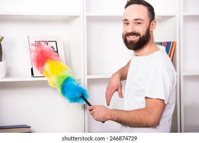 Young Man Is Doing Some Cleaning Work In The House.