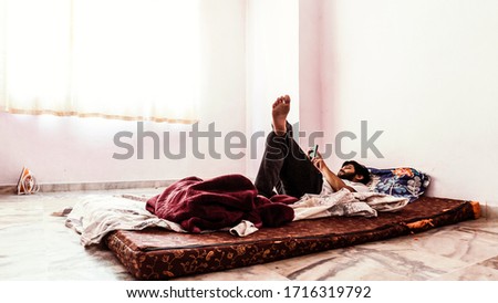 Young man doing timepass alone in the room beacuse for lockdown