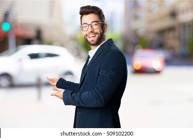 Young Man Doing A Welcome Gesture