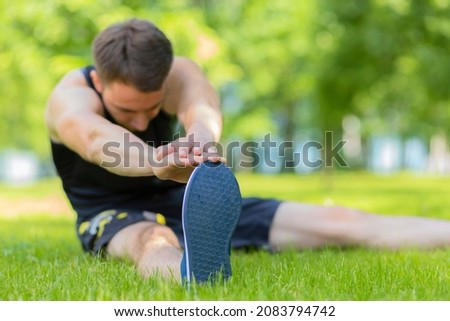 Similar – Jogger stretching in the morning on seaside.