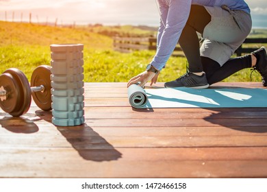 A Young Man Doing Yoga On A Deck With A Beautiful View