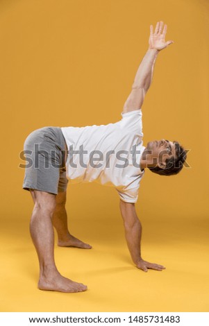 Similar – Mexican yoga teacher practicing side angle pose