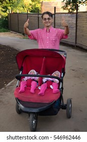 Young Man With Double Pram And Two Kids In It, Twins