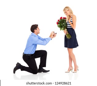 young man down on his knee proposing to girlfriend