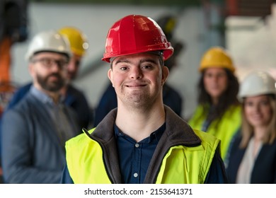Young man with Down syndrome working in industrial factory, social integration concept. - Shutterstock ID 2153641371