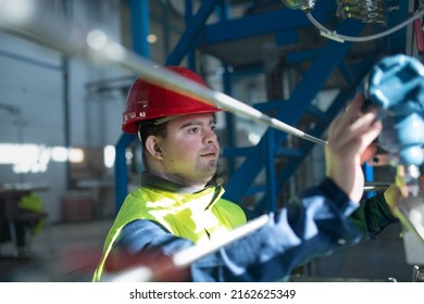 Young Man With Down Syndrome Working In Industrial Factory, Social Integration Concept.