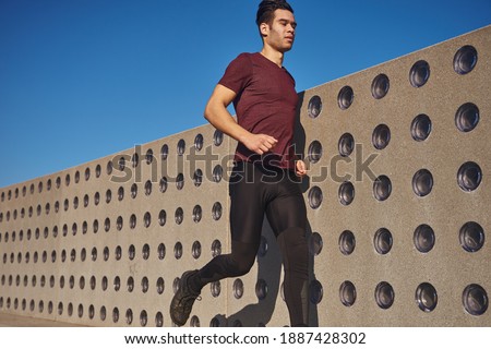 Similar – Image, Stock Photo Young man stretching in the city after jogging