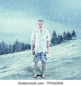 Young Man Dressed In Summer Clothes In Snow.