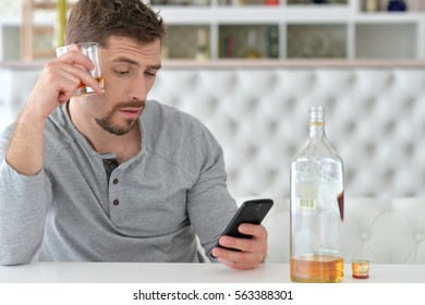 Young Man Drinking Alcohol