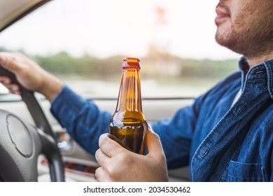 Young Man Drinking Beer While Driving Risk Of Accidents Due To Drunk Driving