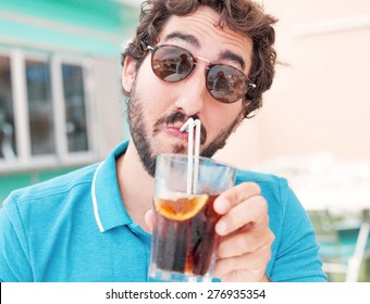 young man drinking coke