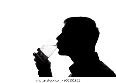 Young Man Drinking A Glass Of Sparkling Water - Silhouette