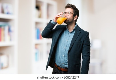 Young Man Drinking A Juice