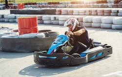 A Young Man Drives A Go Kart At Circuit