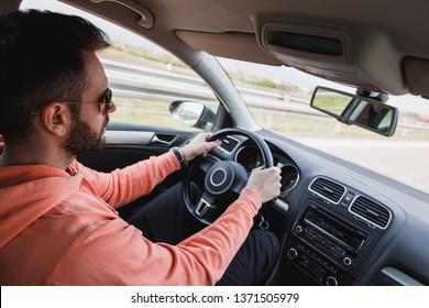 Young Man Driving A Car, Interior Shot