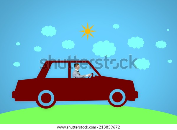 Young man\
driving drawn car. Imagination\
concept