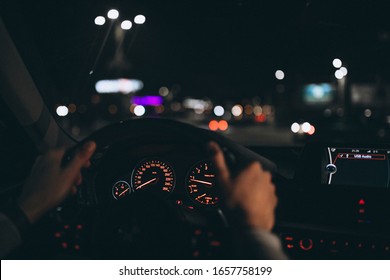 Young Man Driving His Car At A Night Time