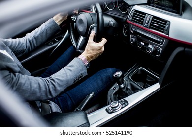 Young Man Driving In The  Modern Car