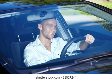 The Young Man Driving A Nice Car