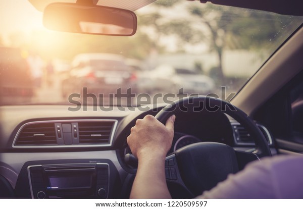 Young man driving with\
safety