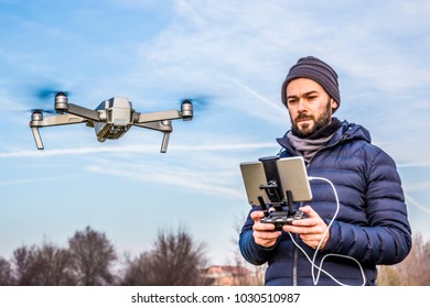 Young man with drone and virtual reality viewer
