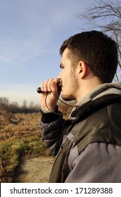 Young Man Duck Calling 