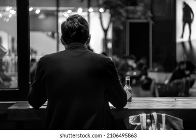 A Young Man Eating Alone