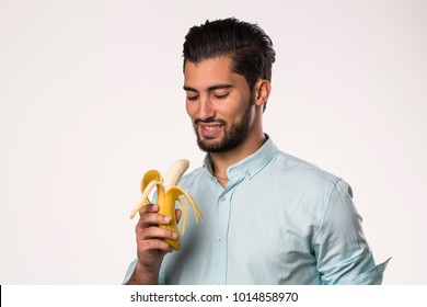 Young Man Eating Banana