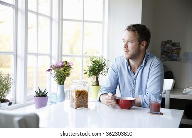 Young Man Eating Breakfast