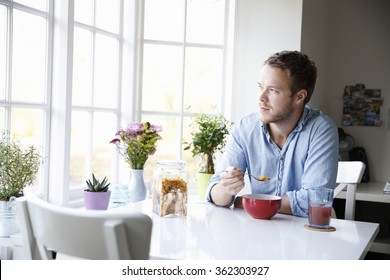 Young Man Eating Breakfast