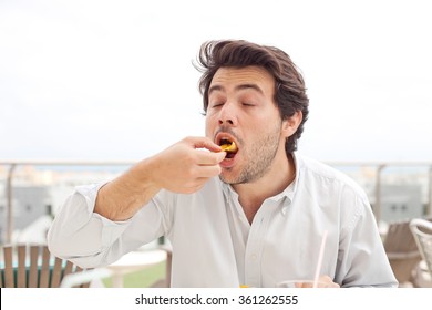 Young Man Eating Chips