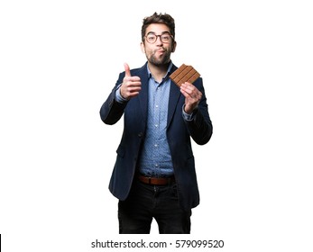 Young Man Eating A Chocolate Bar