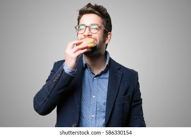 Young Man Eating A Donut