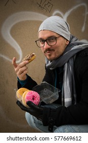 Young Man Eating Donuts