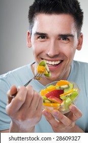 Young Man Eating Fruit Close Up Shoot