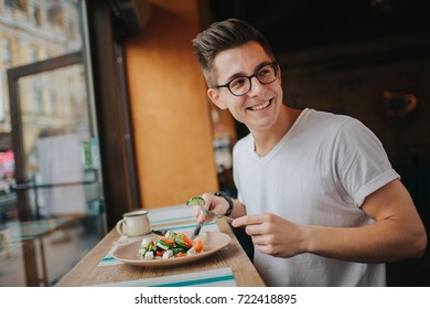 Young Man Eating A Healthy Salad