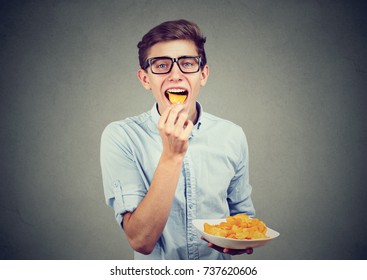 Young Man Eating Potato Chips