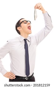 Young Man Eating A Small Fish Isolated On White Background