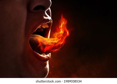 Young man eating spicy food